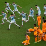 Argentina players celebrate at the end of the World Cup quarterfinal soccer match between the Netherlands and Argentina, at the Lusail Stadium in Lusail, Qatar. (December 10, 2022)