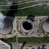 Vapor emerges from a cooling tower at the Agios Dimitrios power plant outside the northern city of Kozani. (June 3, 2022)