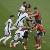 England's players, left, and Spain's players fight for the position during the final match at the Euro 2024 soccer tournament in Berlin, Germany. (July 14, 2024)